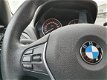 BMW 1-serie - 116i EDE EXECUTIVE | NAVIGATIE | BI-XENON VERLICHTING | HALF LEDEREN BEKLEDING | RIJKL - 1 - Thumbnail