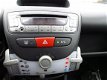 Peugeot 107 - 1.0 Access Accent / airco / 5 deurs / wit / 68 dkm - 1 - Thumbnail