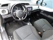 Toyota Yaris - 1.5 Full Hybrid 100pk 5D Aut Aspiration Navigatie en Camera en Climate - 1 - Thumbnail