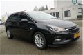 Opel Astra Sports Tourer - 1.0 Business+ AUT AIRCO I NAVI I LMV I AUT VERLICHTING I PDC I METALLIC L - 1 - Thumbnail