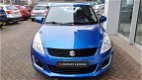 Suzuki Swift - 1.2 COMFORT EASSS Airco | Stoelverwarming | Trekhaak - 1 - Thumbnail