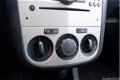 Opel Corsa - 1.2 16v 80pk 3drs. Enjoy Airco/LMV/Org.audio - 1 - Thumbnail