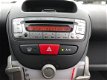 Toyota Aygo - 1.0-12V 5 DRS AIRCO STUURBEKRACHTING KM 51280 - 1 - Thumbnail