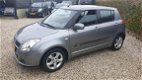 Suzuki Swift - 1.3 Exclusive Automaat/Airco/5drs - 1 - Thumbnail