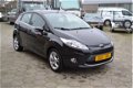 Ford Fiesta - 1.25 Titanium 5.Drs 1e eigenaar bj.2012 107.000 km airco lm.velgen stoelverw. el.ramen - 1 - Thumbnail