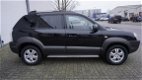 Hyundai Tucson - 2.0i Dynamic Cross org km stand - 1 - Thumbnail