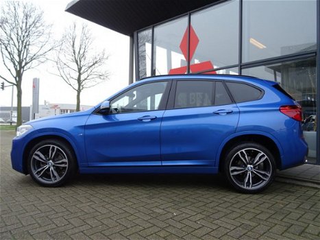 BMW X1 - sDrive18i Centennial High Executive *AUTOMAAT*NAVIGATIE*LEDER* DEALER ONDERHOUDEN - 1