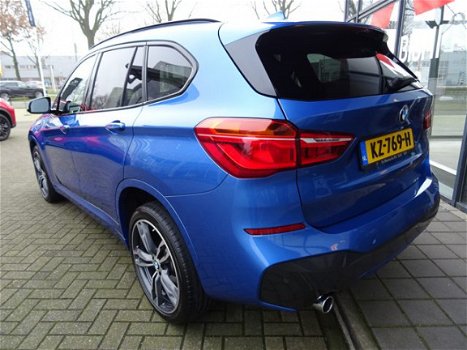 BMW X1 - sDrive18i Centennial High Executive *AUTOMAAT*NAVIGATIE*LEDER* DEALER ONDERHOUDEN - 1