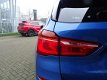 BMW X1 - sDrive18i Centennial High Executive *AUTOMAAT*NAVIGATIE*LEDER* DEALER ONDERHOUDEN - 1 - Thumbnail