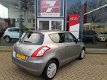 Suzuki Swift - 1.2 Comfort EASSS Airco, Radio CD/USB, Stoelverwarming, Elektrische ramen/spiegels - 1 - Thumbnail