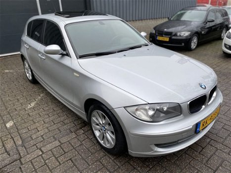 BMW 1-serie - 118i Navigatie, ECC, Schuifdak, Stoelverwarming - 1