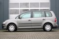 Volkswagen Touran - 1.4 TSI Optive 140pk Airco/Cruise/Elek.Ramen/C.V./Trekhaak/6-Bak/APK:17-7-2020 - 1 - Thumbnail