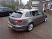 Seat Leon ST - 1.6 TDI Ecomotive Lease Sport LEER NAVIGATIE TREKHAAK PDC - 1 - Thumbnail