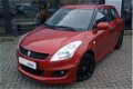 Suzuki Swift - 1.2 Exclusive X-cite + KEYLESS + KLIMA + LEDER PAKKET + LM VELGEN - 1 - Thumbnail