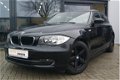 BMW 1-serie - 116i High Executive + LEER + NAVI PROF + LM VELGEN + CRUISE - 1 - Thumbnail