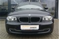 BMW 1-serie - 116i High Executive + LEER + NAVI PROF + LM VELGEN + CRUISE - 1 - Thumbnail