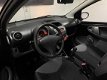 Peugeot 107 - 1.0-12V XR 2006 Zwart - Stuurbekrachtiging - AUX - NAP - 1 - Thumbnail