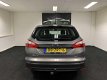 Ford Focus Wagon - 1.6 TDCI ECOnetic Lease Titanium 2013 Bruin AIRCO -Navigatie - USB/AUX/PDC - NAP - 1 - Thumbnail