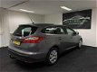 Ford Focus Wagon - 1.6 TDCI ECOnetic Lease Titanium 2013 Bruin AIRCO -Navigatie - USB/AUX/PDC - NAP - 1 - Thumbnail