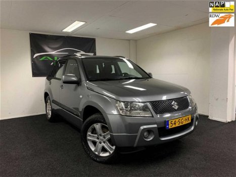 Suzuki Grand Vitara - 2.0-16V Exclusive 2006 Grijs AIRCO - 4x4 - Hoge Instap - APK 2021 - NAP - 1