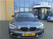 BMW 1-serie - 114i Business+ Leder/PDC/Navi/sportbak - 1 - Thumbnail