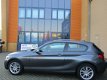 BMW 1-serie - 114i Business+ Leder/PDC/Navi/sportbak - 1 - Thumbnail