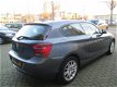 BMW 1-serie - 114i Business+ Leder/PDC/Navi/sportbak - 1 - Thumbnail