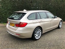 BMW 3-serie Touring - 320i High Executive inclusief winterbanden set op lichtmetalen velgen