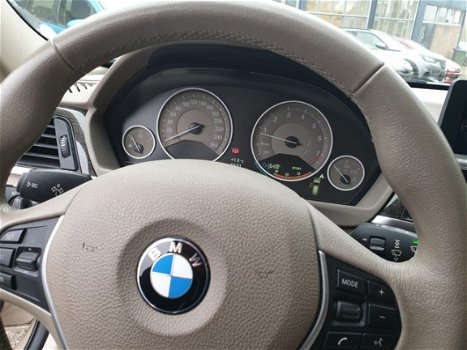 BMW 3-serie Touring - 320i High Executive inclusief winterbanden set op lichtmetalen velgen - 1