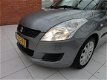 Suzuki Swift - 1.2 Bandit EASSS / airco / stoelverwarming (voor) / trekhaak nette auto - 1 - Thumbnail