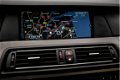 BMW 5-serie - 520I High Executive Automaat (GROOT NAVI, LEDER, XENON, AMBIANCE VERLICHTING, STOELVER - 1 - Thumbnail