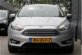 Ford Focus Wagon - 1.0 100pk Titanium | Dealer onderhouden | Climate control | Navigatie | Cruise co - 1 - Thumbnail