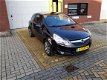Opel Corsa - 1.2-16V '111' Edition Zwart Airco 2e eigenaar - 1 - Thumbnail
