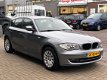 BMW 1-serie - 118i High Executive Automaat/Leder/Cruise-Control/Parkeersensoren/LMV - 1 - Thumbnail