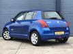 Suzuki Swift - 1.3 Comfort / 5 DEURS / AIRCO / TREKHAAK - 1 - Thumbnail