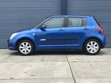 Suzuki Swift - 1.3 Comfort / 5 DEURS / AIRCO / TREKHAAK - 1