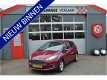 Ford Fiesta - 1.25 Titanium met stoeverwarming Winterbanden aanwezig - 1 - Thumbnail