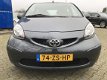 Toyota Aygo - 1.0i-12V 5DR AIRCO ELECTR.RAMEN C.SLOT OP AFSTAND DEALER-ONDERHOUDEN MET ONDERHOUDSHIS - 1 - Thumbnail