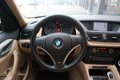 BMW X1 - sDrive18i Executive / Navigatie / Cruise Control - 1 - Thumbnail