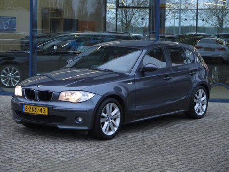 BMW 1-serie - 120D 5-DRS AUT. | NAVI | LEDER | SPORTSTOELEN | CRUISE - 1