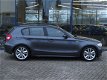 BMW 1-serie - 120D 5-DRS AUT. | NAVI | LEDER | SPORTSTOELEN | CRUISE - 1 - Thumbnail