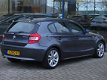 BMW 1-serie - 120D 5-DRS AUT. | NAVI | LEDER | SPORTSTOELEN | CRUISE - 1 - Thumbnail