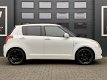 Suzuki Swift - 1.3 EDITION - AIRCO - 5DRS - EL PAKKET - NAVI - 1 - Thumbnail