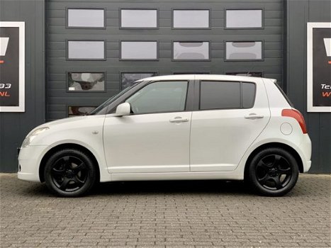 Suzuki Swift - 1.3 EDITION - AIRCO - 5DRS - EL PAKKET - NAVI - 1