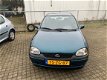 Opel Corsa - 1.4i Strada, stuurbekrachtigen en apk - 1 - Thumbnail