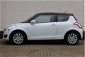 Suzuki Swift - 1.2 Exclusive EASSS | Climate Control | Cruise Control | Stoelverwarming - 1 - Thumbnail