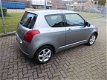 Suzuki Swift - 1.3 Exclusive Automaat/Airco - 1 - Thumbnail