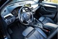 BMW X1 - 2.0i Essential AUT Panorama/Leer/LED Origineel NL - 1 - Thumbnail