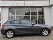 BMW 1-serie - 116i high executive - 1 - Thumbnail