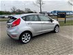 Ford Fiesta - 1.25 Ghia //2E EIGENAAR//AIRCO//STOELVERWARMING//SPRAAK BEDIENNING//STUURWIEL BEDIENIN - 1 - Thumbnail